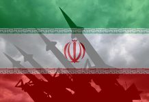 Iranian flag overlaid with image of military missiles.