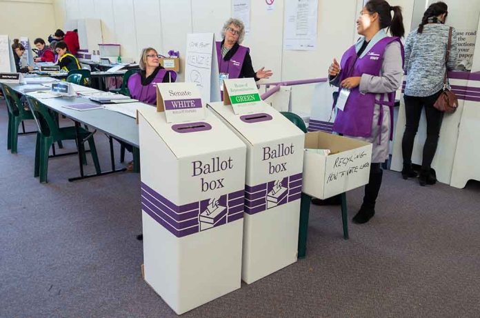 Election polling station with ballot boxes and officials.