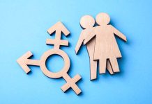 Figures and transgender symbol on a blue background.