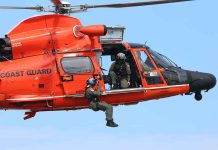 Coast Guard helicopter with rescue personnel onboard.