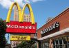 McDonald's restaurant with large advertising sign outside.