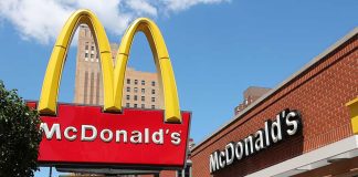 McDonald's restaurant with large advertising sign outside.