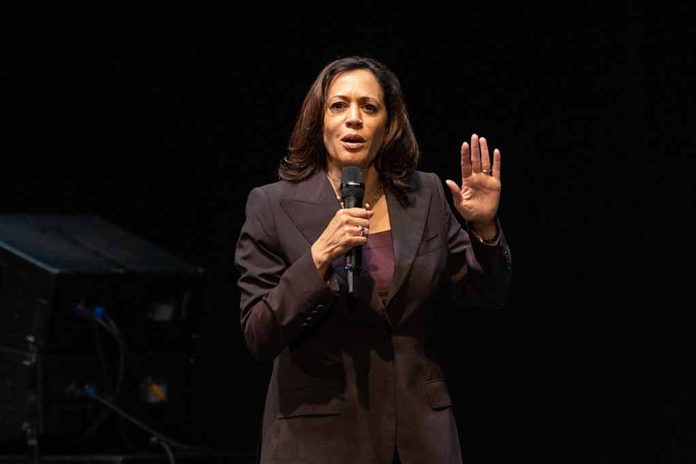 Person speaking on stage with a microphone.