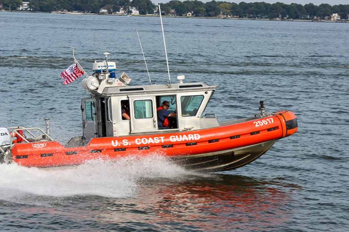 Coast Guard boat speeding on the water.