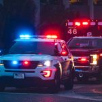 Police car and ambulance with flashing lights.