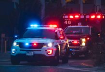 Police car and ambulance with flashing lights.