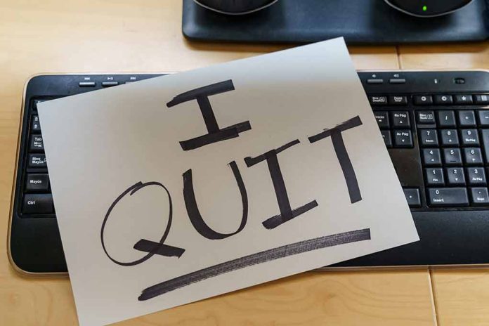 Paper with "I QUIT" on keyboard.