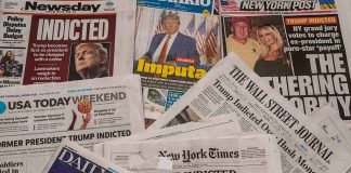 Newspaper headlines about Trump's indictment.