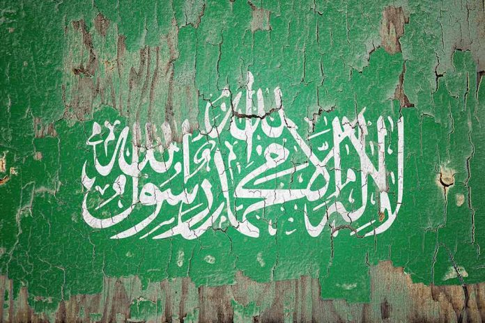 White Arabic script on weathered green background.