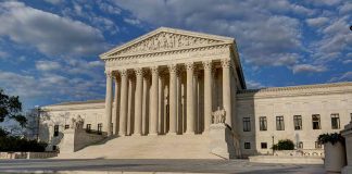 Supreme Court building with steps and columns.