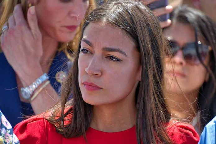 Woman in red shirt with serious expression, background blurry.