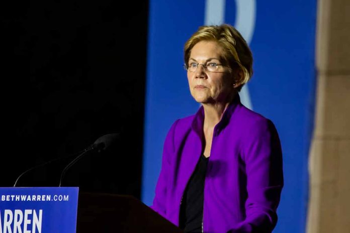 Woman in purple jacket speaking at podium.