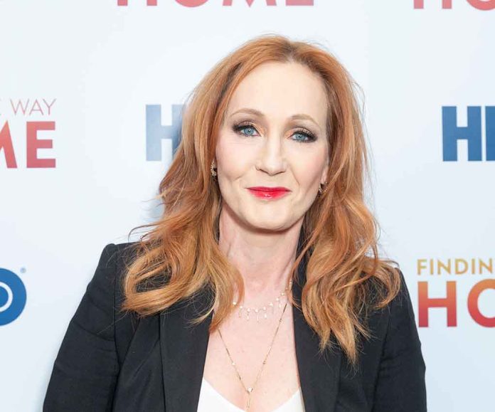 Woman with red hair smiling at an event.