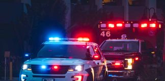 Police car and ambulance with flashing lights.