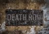 Weathered Death Row sign on aged concrete wall