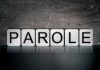 Blocks spelling "PAROLE" on grungy background.