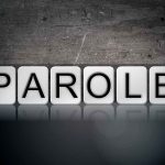 Blocks spelling "PAROLE" on grungy background.