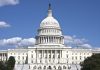 U.S. Capitol building against blue sky.