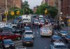 Police activity on a city street with emergency vehicles.