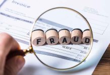 Magnifying glass showing FRAUD on an invoice