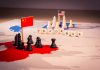 Chess pieces and flags on trade war map