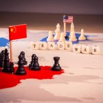 Chess pieces and flags on trade war map