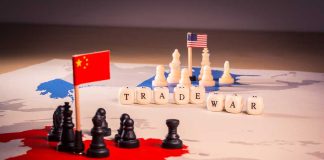 Chess pieces and flags on trade war map