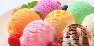 Assorted ice cream scoops with raspberries on a plate