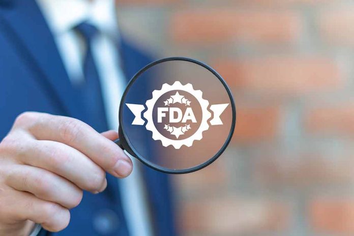1599868912 featured image Person holding magnifying glass with FDA logo