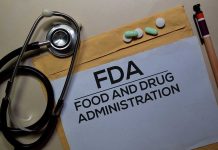 Stethoscope and FDA documents with pills and pen