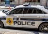 FBI police car parked on city street