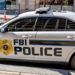 FBI police car parked on city street
