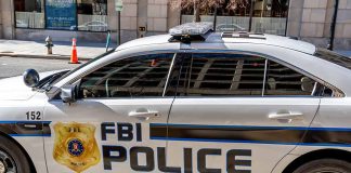 FBI police car parked on city street