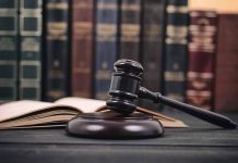 Gavel and open book in library setting