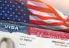 Closeup of US visa and flag image