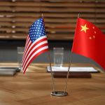 American and Chinese flags on a conference table