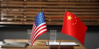 American and Chinese flags on a conference table