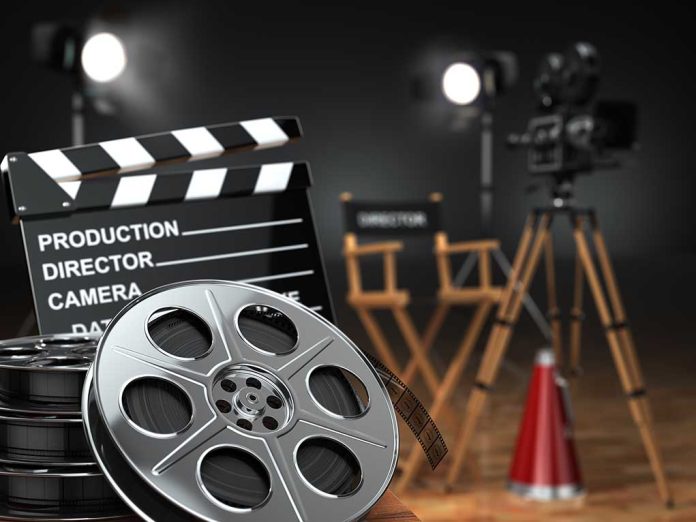 Movie set with film reels and clapperboard