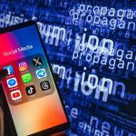 Smartphone showing social media apps with text background