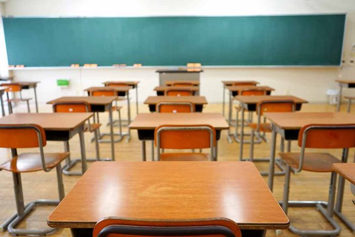 356921618 featured image Classroom with wooden desks and empty green chalkboard