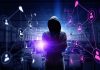 Hacker in hooded sweatshirt with digital connections overlay