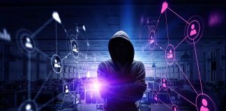 Hacker in hooded sweatshirt with digital connections overlay
