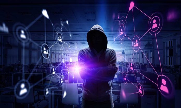 635529080 featured image Hacker in hooded sweatshirt with digital connections overlay