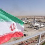 Iranian flag near an industry