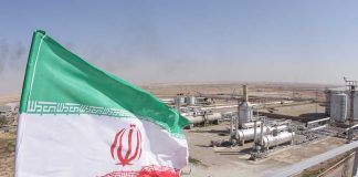 Iranian flag near an industry
