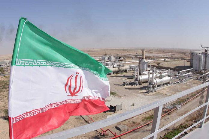 1227310843 featured image Iranian flag near an industry