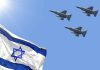 Israeli flag with three fighter jets flying overhead
