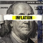 inflation text over torn hundreddollar bill