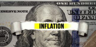 inflation text over torn hundreddollar bill