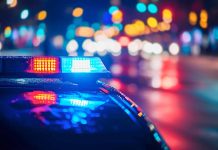 Police car with flashing lights at night